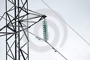 Glass prefabricated high voltage insulators on poles high-voltage power lines. Electrical industry