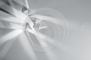 Glass prisms and cubes with rays. Abstract background with reflection and refraction of light. Shadow and rays of natural light