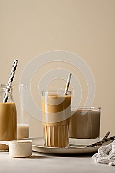 Glass of protein chocolate drink milkshake or coffee refreshing drink, moody lifestyle photo