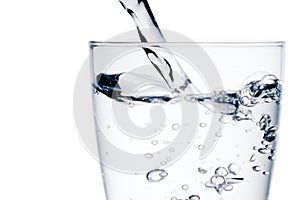 Glass with pure water with bubbles