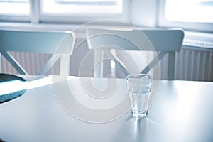 Glass of pure water on kitchen table