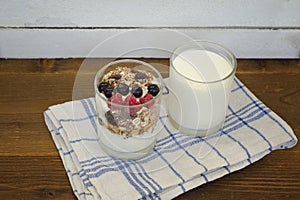 Glass of pure yogurt and yogurt with granola and fruit. Healthy