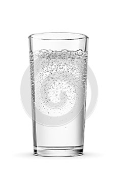 Glass of purified sparkling water isolated white