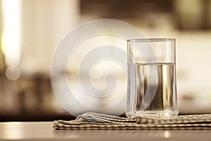 the Glass of purified water on the table bar in kitchenroom