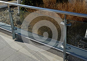 the glass railing fillings are attached to the stainless steel tubular frame