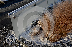 glass railing with metal handle made of polished stainless steel