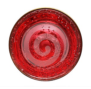 Glass with red aerated water