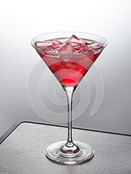 Glass of red iced cocktail