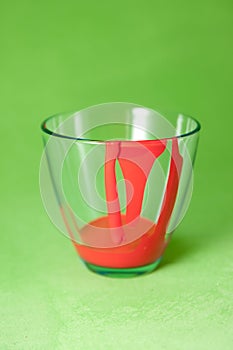 Glass with red paint