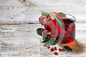 Glass of red pomegranate juice, summer drink
