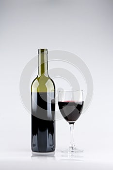 Glass of Red Wine with Bottle