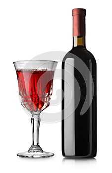 Glass of red wine and bottle
