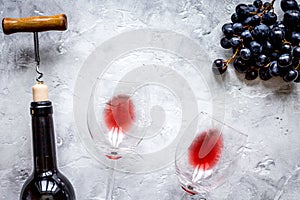 Glass of red wine and bottle on white background