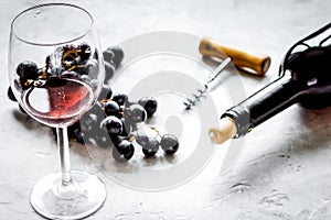 Glass of red wine and bottle on white background