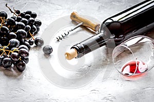 Glass of red wine and bottle on white background