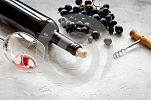 Glass of red wine and bottle on white background