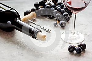 Glass of red wine and bottle on white background