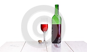 Glass with red wine bottle on white background, elegant and expensive red glass and bottle wine