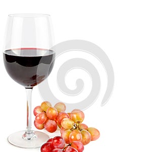 Glass of red wine and bunch of grapes isolated on white background. Free space for text