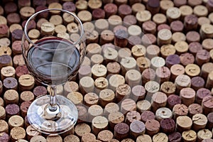 Glass of red wine on cork tabl