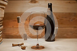 A glass of red wine with flying corks