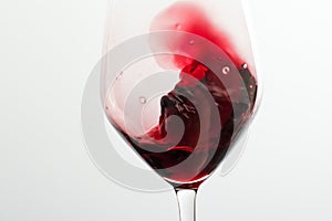 Glass of red wine, pouring drink at luxury holiday tasting event, quality control splashing liquid motion background for oenology