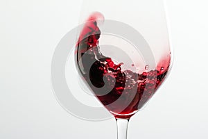 Glass of red wine, pouring drink at luxury holiday tasting event, quality control splashing liquid motion background for oenology