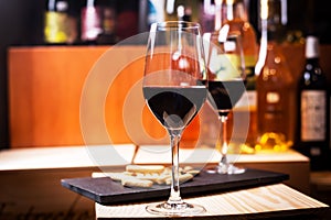 Glass of red wine prepared for tasting in a Europe winery. Copy space