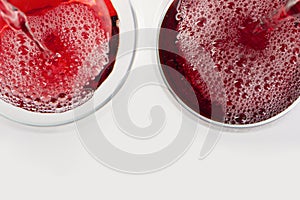 Glass of red wine with shadow.Top view. Abstract red wine bubbles