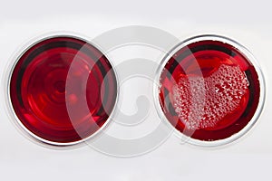 Glass of red wine with shadow.Top view. Abstract red wine bubbles