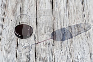Glass of red wine on vintage wooden