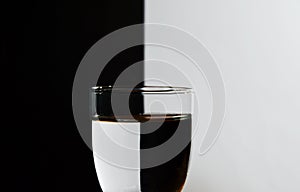 Glass with refraction light in black and white background