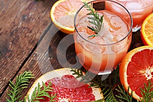 Glass of refreshing alcohol drink with orange juice, vodka or white rum served with ice orange slice.
