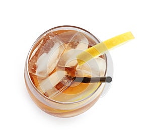 Glass of refreshing iced tea with lemon slices on background, top view