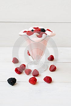 A glass of refreshing raspberry milkshake for breakfast