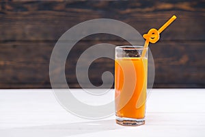 Glass of refreshing vegetable juice with straw