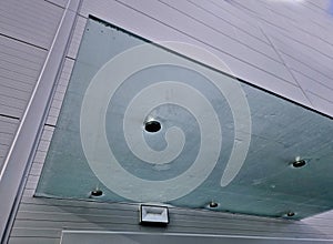 Glass roof above entrance industrial building with metal cladding