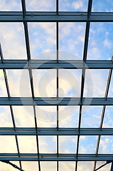 Glass roof in building on blue sky