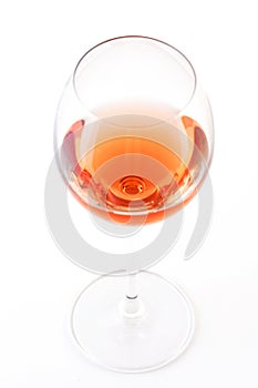 Glass of rose wine on white bacground