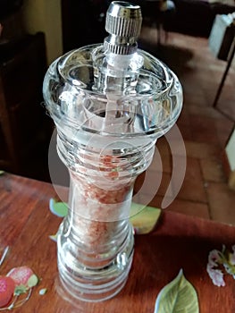 salt grinder with pink himalyan salt crystals photo