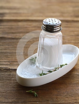 Glass saltcellar with salt photo