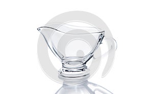 Glass sauceboat on white background