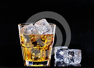 Glass of scotch whiskey and ice