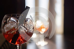 Glass of scotch whiskey and ice on the background of the bar.