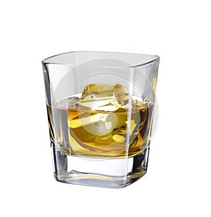 Glass of scotch whiskey with ice cubes isolated on a white background