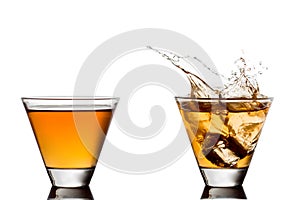 Glass of scotch whiskey and ice on a white background