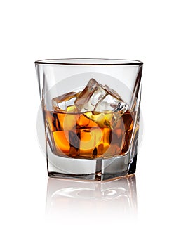 Glass of scotch whiskey and ice photo