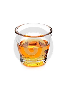 Glass of scotch whiskey on white background