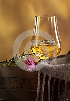 Glass of Scotch Whisky and Scottish Thistle