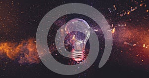 Glass shards and fire exploding from broken lightbulb